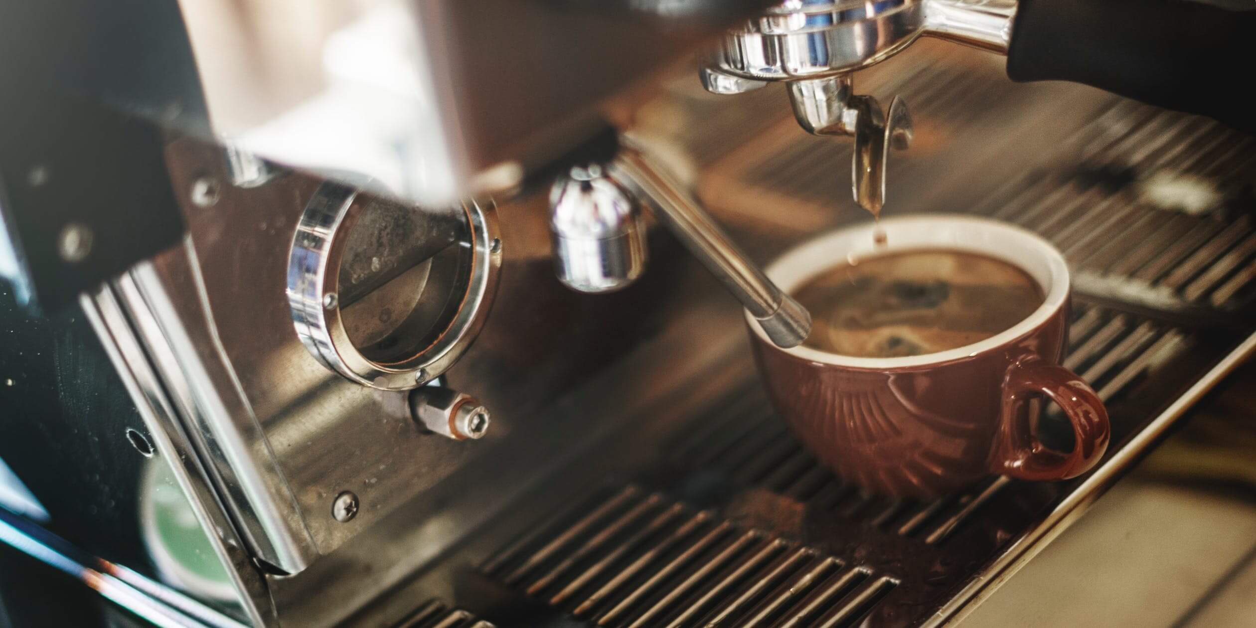 fresh coffee under espresso machine