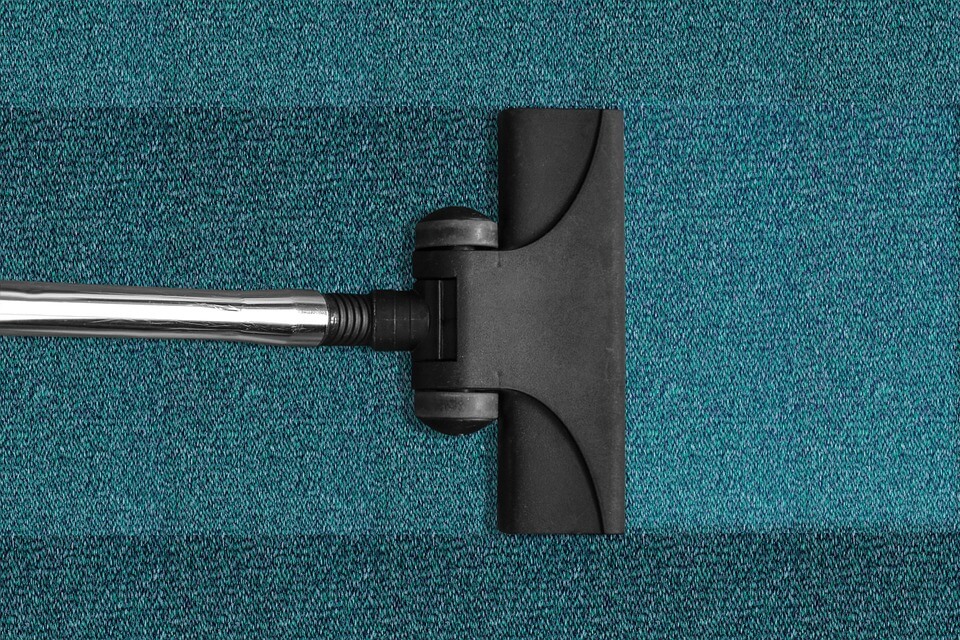 vacuuming carpet