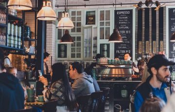 Photo of a cafe full of people