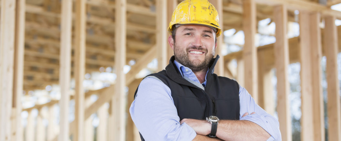 Carpenter wearing hardhat at construction site