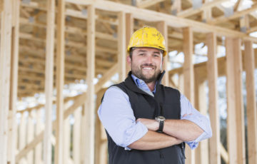 Carpenter wearing hardhat at construction site