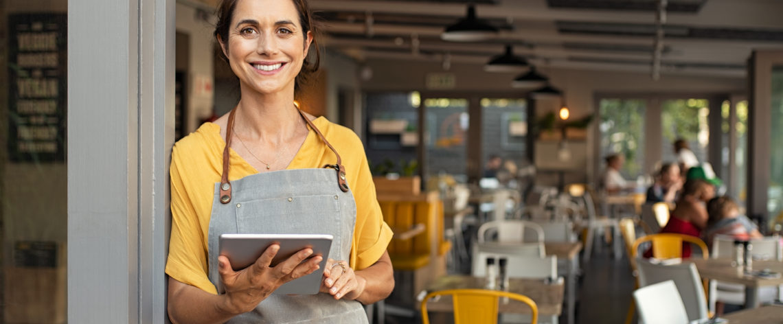 restaurant owner waiting to take your order